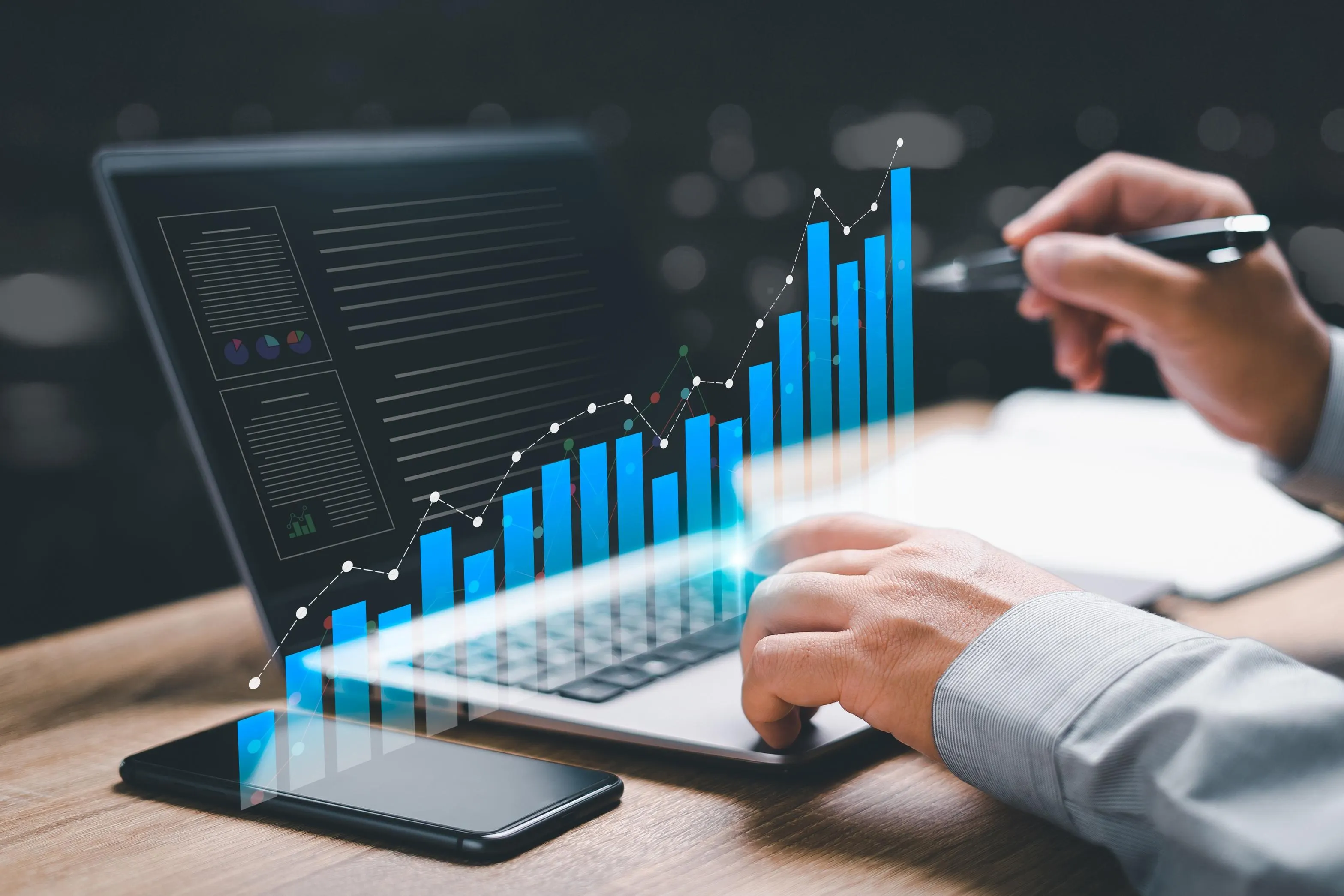 Laptop showing growth analytics chart